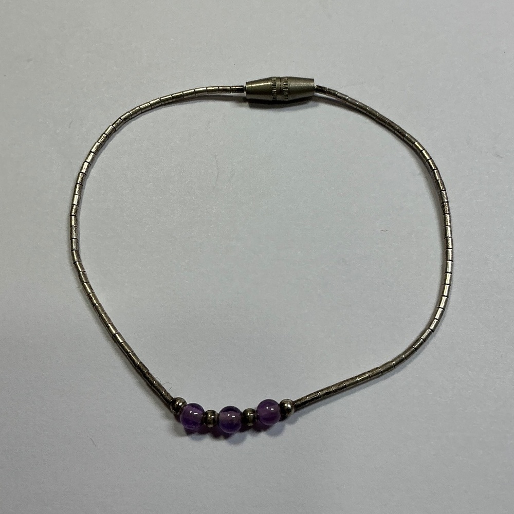 Liquid Sterling Silver bracelet with 3 amethyst color beads, 6.25” long